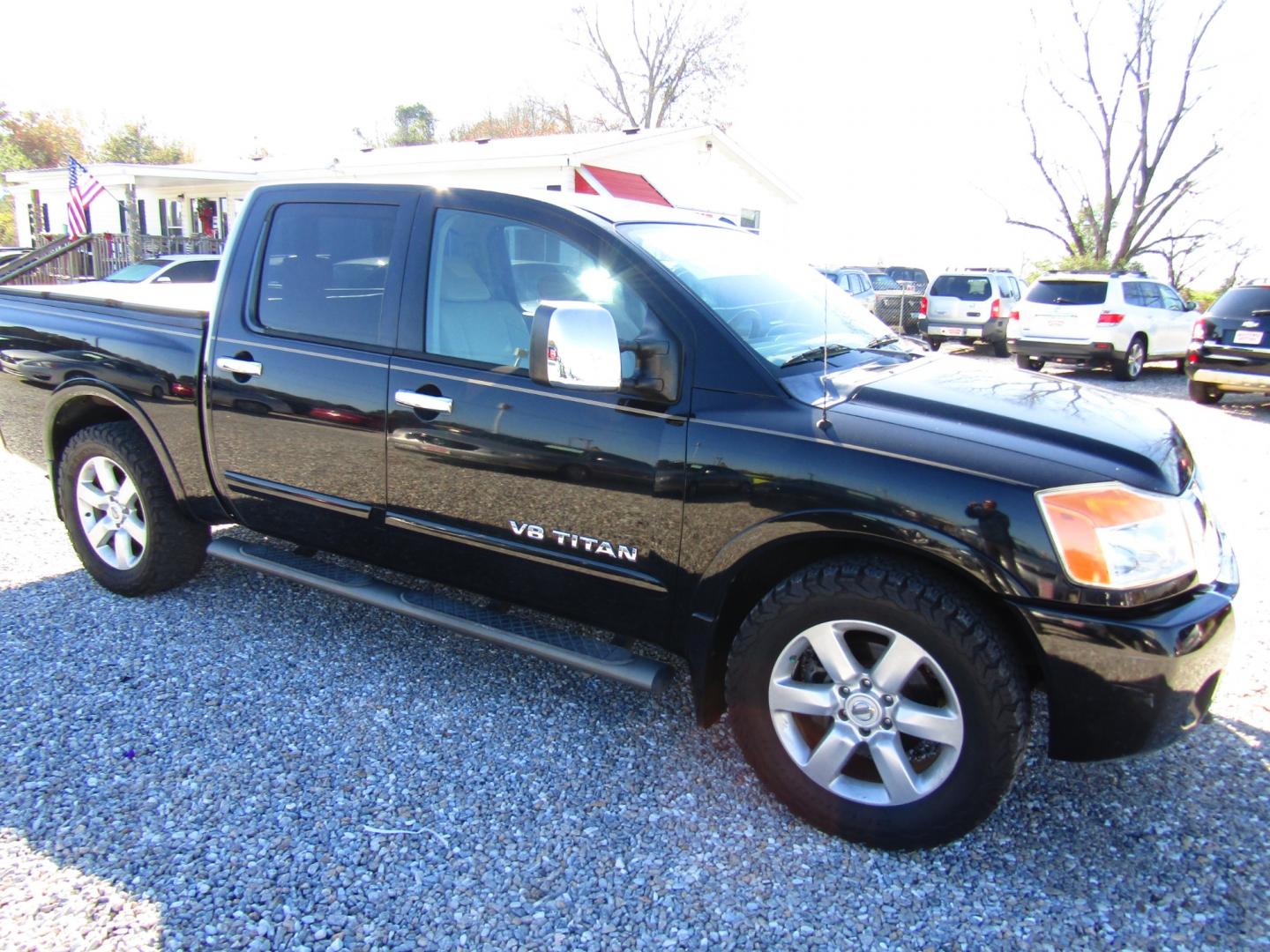 2011 Black /Tan Nissan Titan (1N6BA0ED1BN) , Automatic transmission, located at 15016 S Hwy 231, Midland City, AL, 36350, (334) 983-3001, 31.306210, -85.495277 - Photo#0